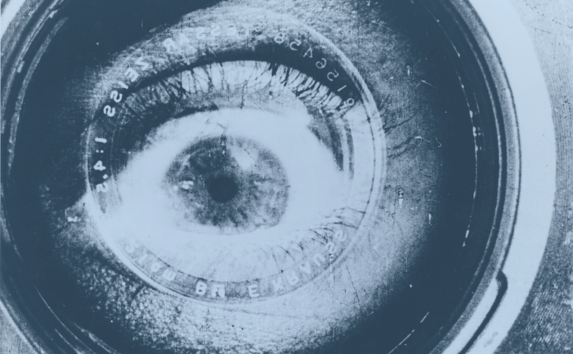 still image from "Man with a Movie Camera," of a human eye superimposed on a camera lens